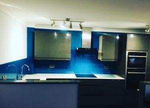 Blue kitchen glass splashback